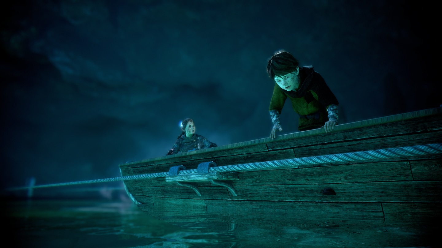 Amicia and Hugo looking down while crossing a water body